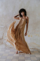Kasia Kulenty GIA gown in sand, a flowing maxi dress with elegant design, perfect for sophisticated occasions.