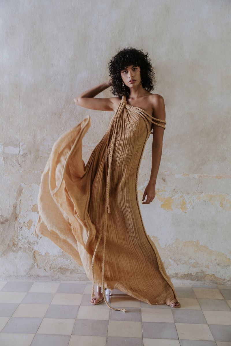 Kasia Kulenty GIA gown in sand, a flowing maxi dress with elegant design, perfect for sophisticated occasions.