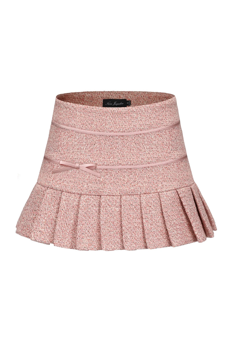Pink GIA mini skirt by Nana Jacqueline featuring pleated design, styled for a chic and trendy look.