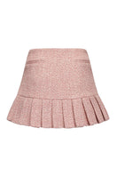 Nana Jacqueline pink GIA mini skirt with pleated design, shown from the back in this stylish fashion image.