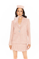 Pink GIA mini skirt by Nana Jacqueline featuring pleated design, shown in a stylish, casual look.