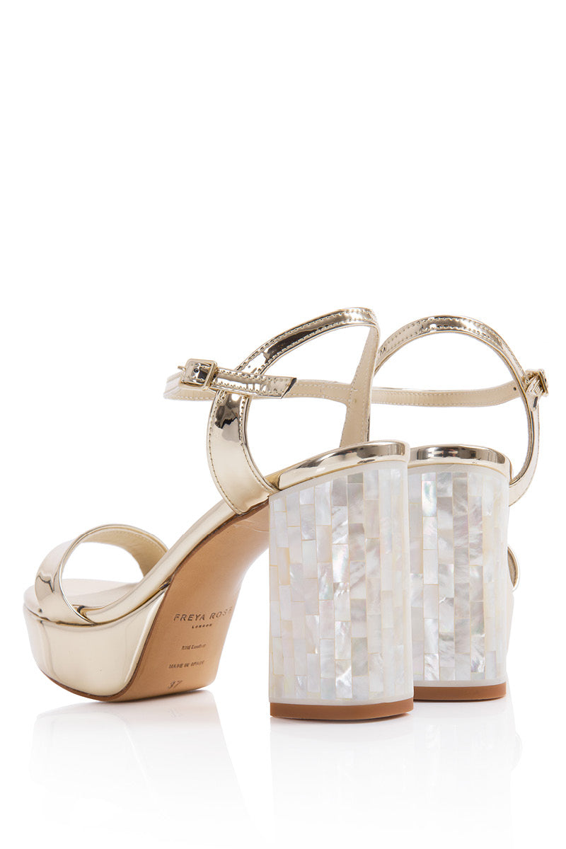 Elegant champagne-colored Gigi heels by Freya Rose with sleek stiletto design and pointed toes, perfect for formal occasions.