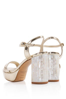 Elegant champagne-colored Gigi heels by Freya Rose featuring a sleek design and pointed toes.