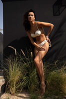 Suncillo Gina glossy bikini top in white pearl with a smooth, shiny finish, featuring a classic triangle style and adjustable straps.