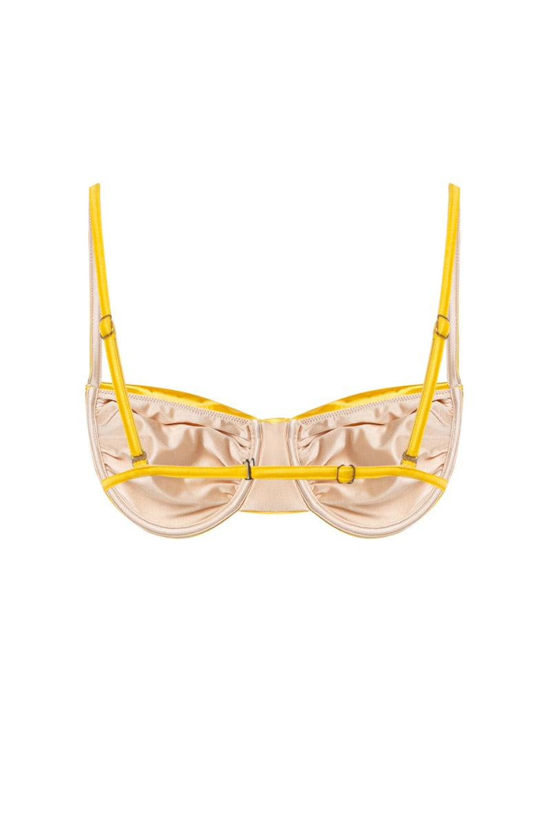 Suncillo Gina glossy bikini top in Sicily yellow with adjustable straps, shown on a mannequin. Bright, stylish swimwear for summer.