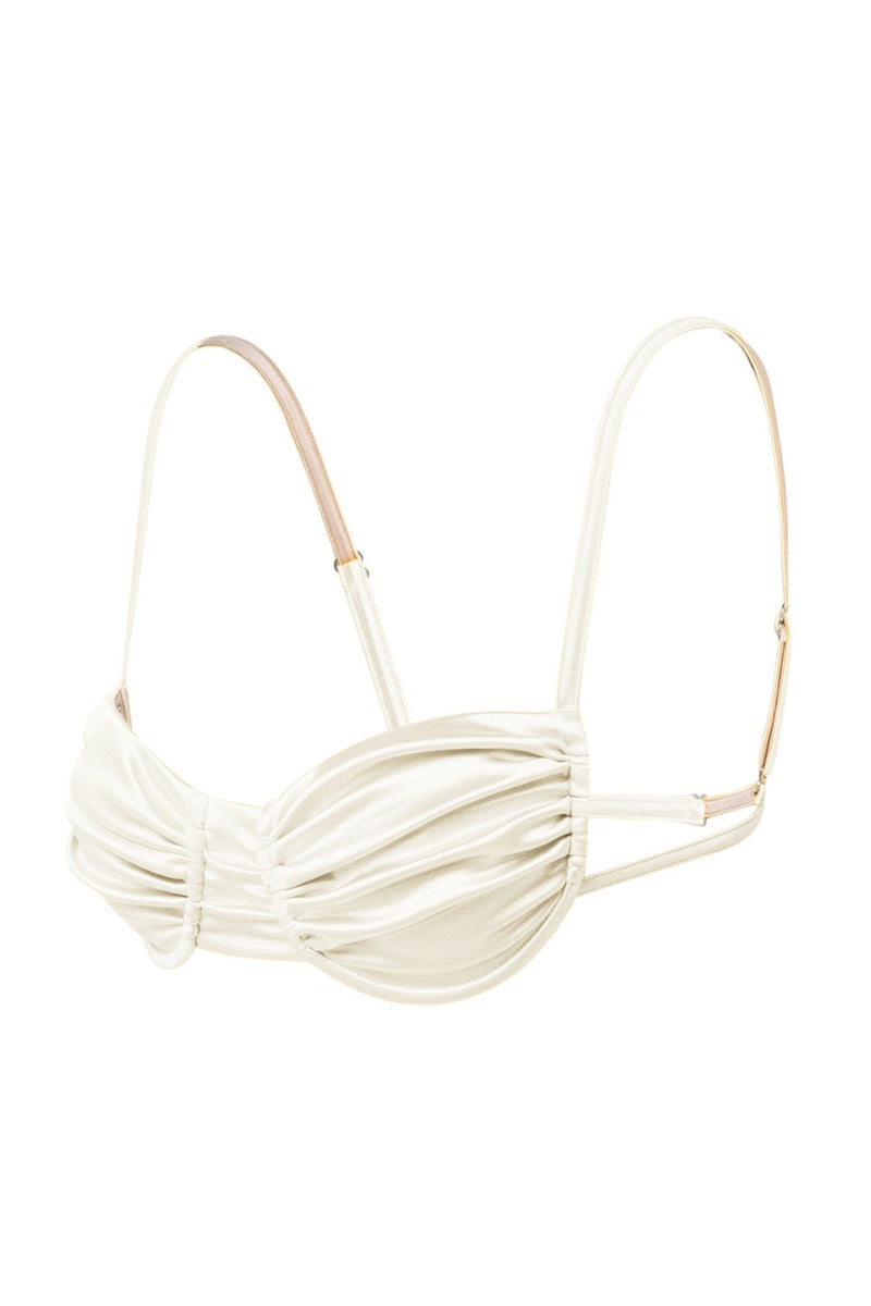 White pearl Gina glossy bikini top by Suncillo, featuring smooth fabric and adjustable straps, shown on a model.