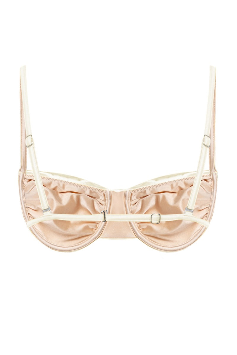 White pearl Gina glossy bikini top by Suncillo featuring a sleek design and adjustable straps on a flat lay.