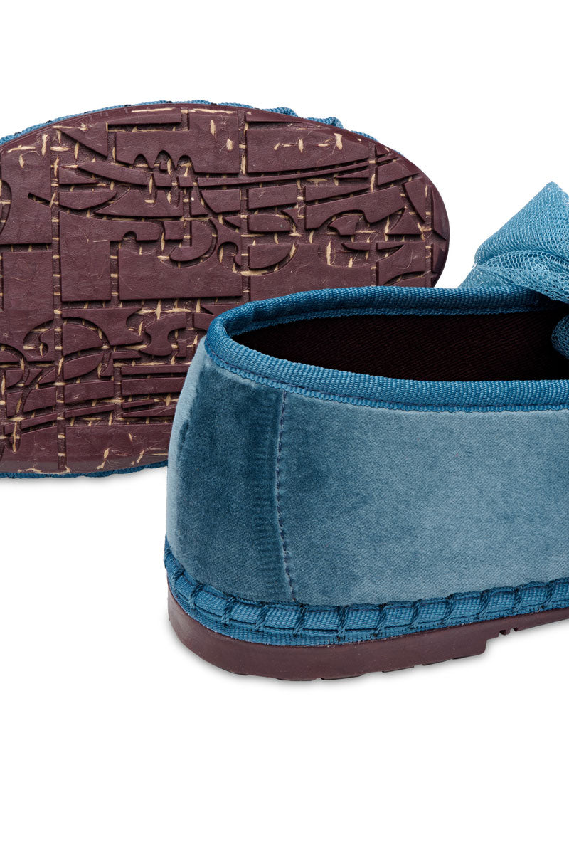Flabelus Ginevra blue flats shown from the side with a rounded toe and sleek design, perfect for casual or dressy outfits.