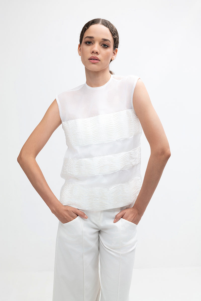 Cream-colored Ginny Top by ANA + MARIA, featuring a stylish and fitted design, shown in high-resolution image.