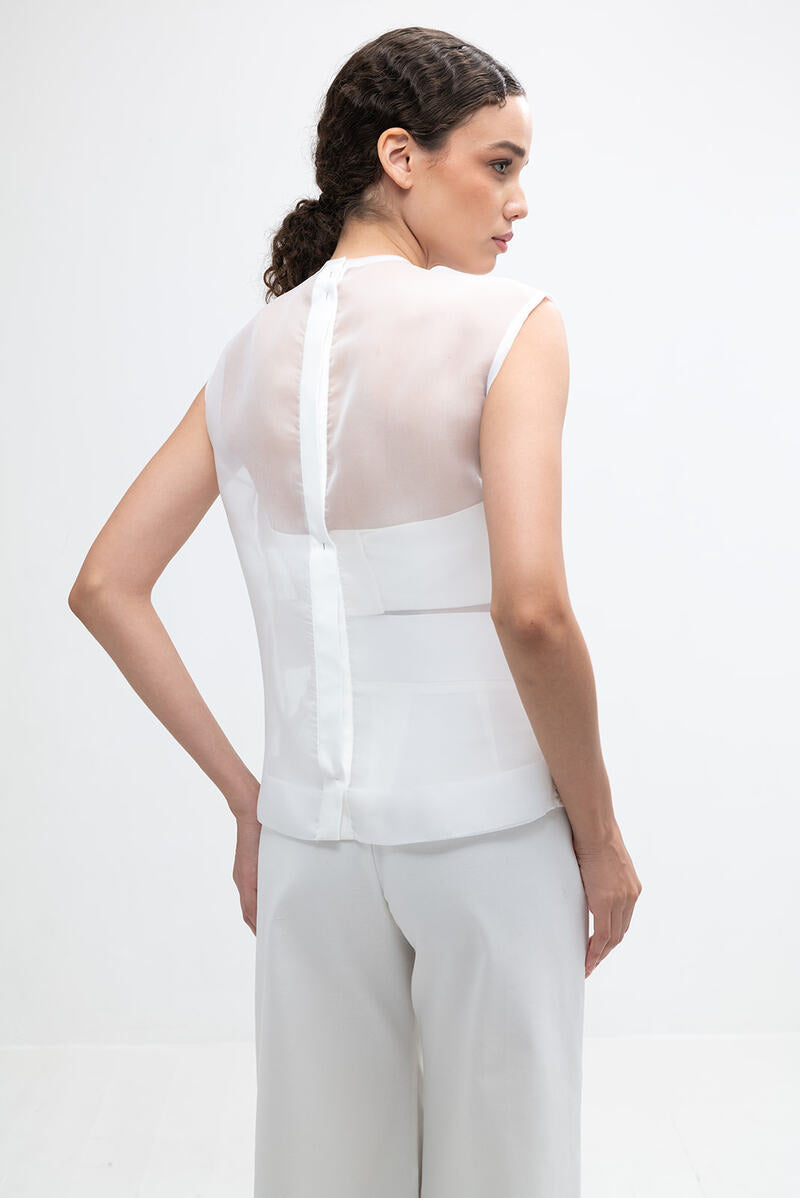 Ivory Ginny Top by ANA + MARIA, featuring a stylish sleeveless design with a fitted silhouette, displayed on a neutral background.