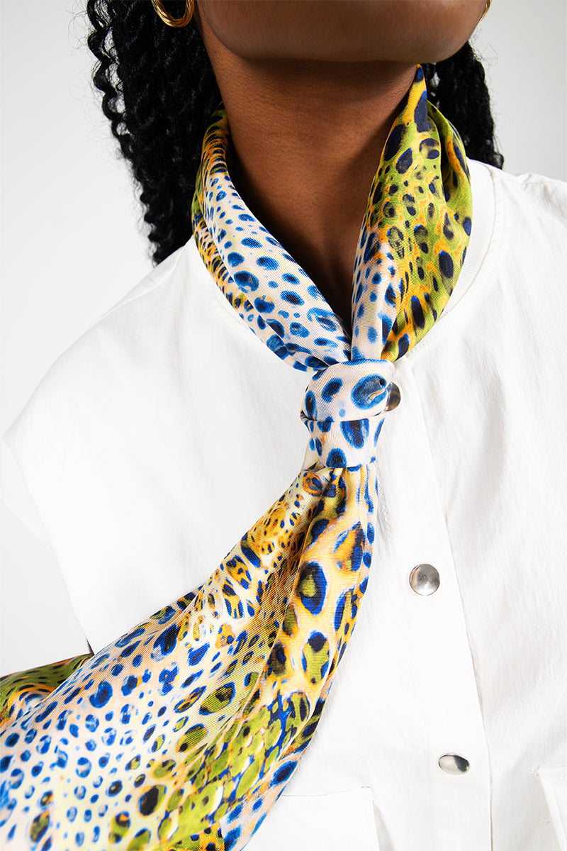 Elegant GIO MOUSSARD silk scarf by Amel Batita featuring intricate patterns and vibrant colors, detailed close-up view.