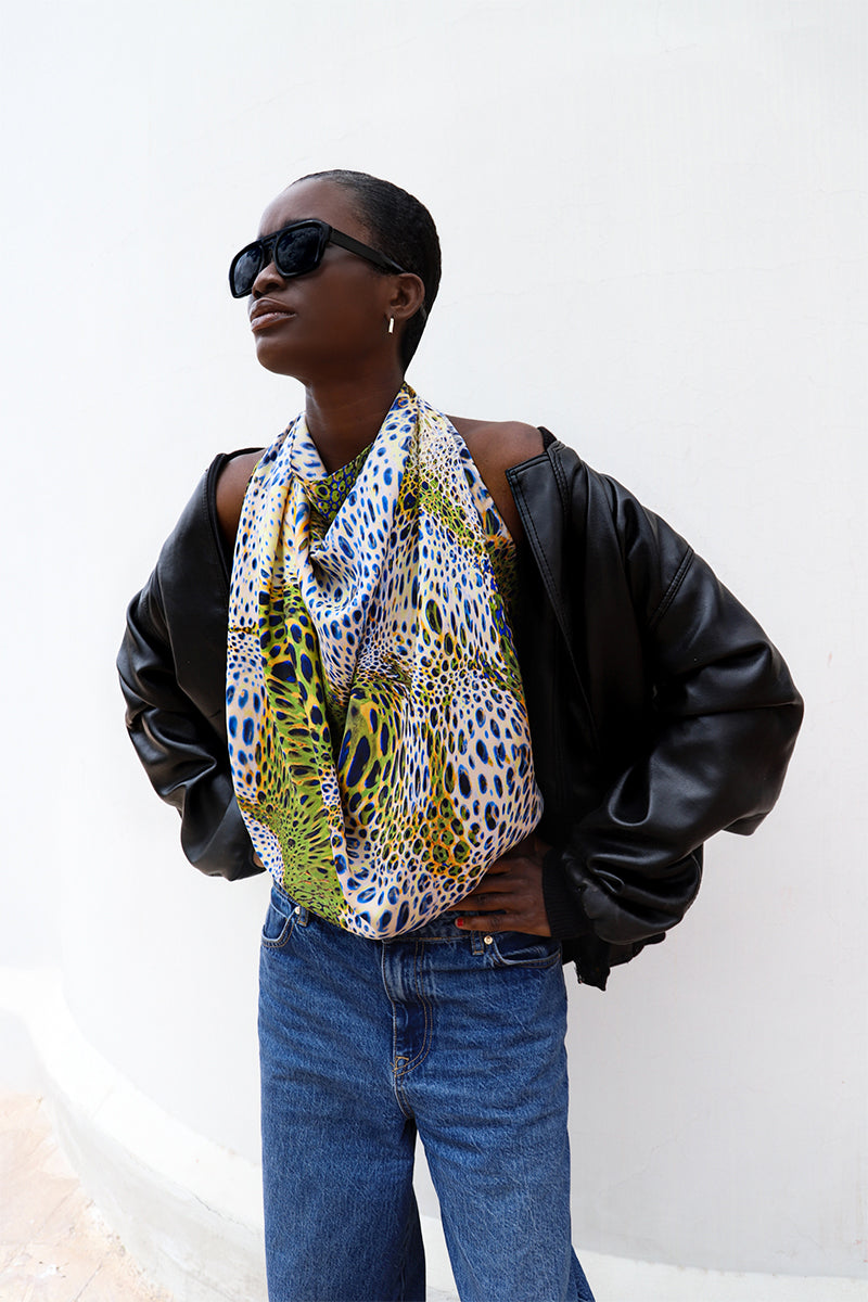 Elegant silk scarf by Amel Batita featuring the GIO MOUSSARD design with intricate patterns and vibrant colors.