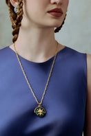 Elegant Giotto pendant necklace by Maria Frering featuring a delicate design and gold finish.