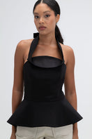 Black Giselle top by ANA + MARIA, featuring a stylish design, displayed on a mannequin with a close-up of the fabric texture.