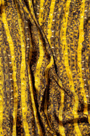Golden Brocot silk scarf by Amel Batita featuring intricate brocot patterns and luxurious silky texture.