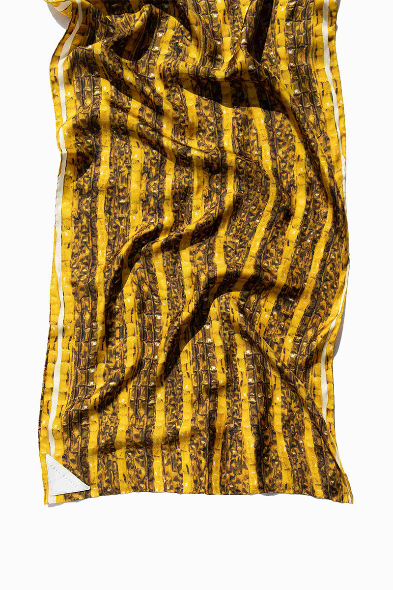 Gold Brocot silk scarf by Amel Batita, elegant brocade pattern, lightweight and luxurious accessory for stylish outfits.