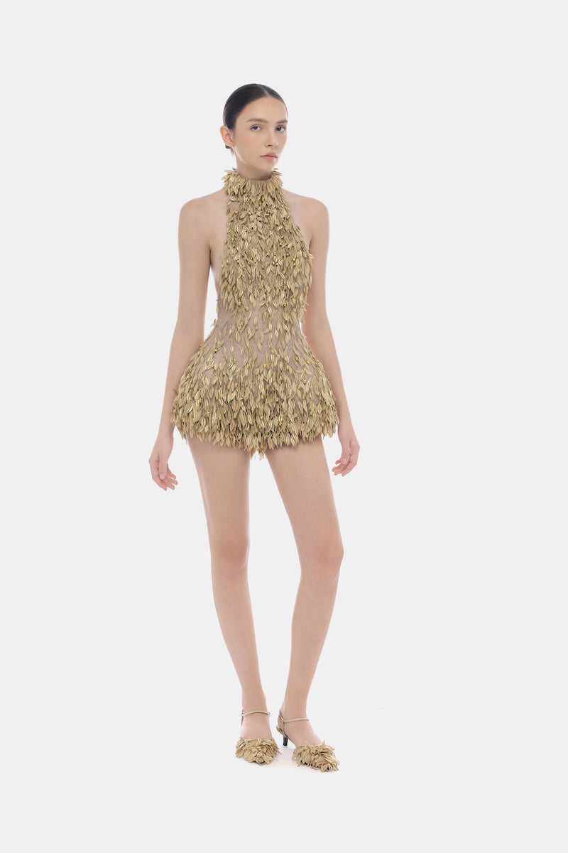 Gold high neck jumpsuit by Montsand featuring a stylish, fitted design and long sleeves, perfect for elegant occasions.