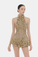 Gold high neck jumpsuit by Montsand, stylish one-piece with a fitted silhouette and elegant high neckline, shown on a model.