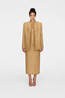 Montsand Gold Julia Jacket displayed on a hanger, showcasing its shiny gold fabric and stylish design for women's jackets.
