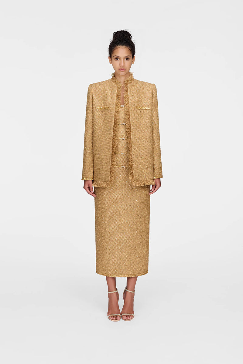 Montsand Gold Julia Jacket displayed on a hanger, showcasing its shiny gold fabric and stylish design for women's jackets.