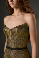 Gold metallic jacquard lotus jacquard column gown with petal-shaped detailing from I.H.F Studio.