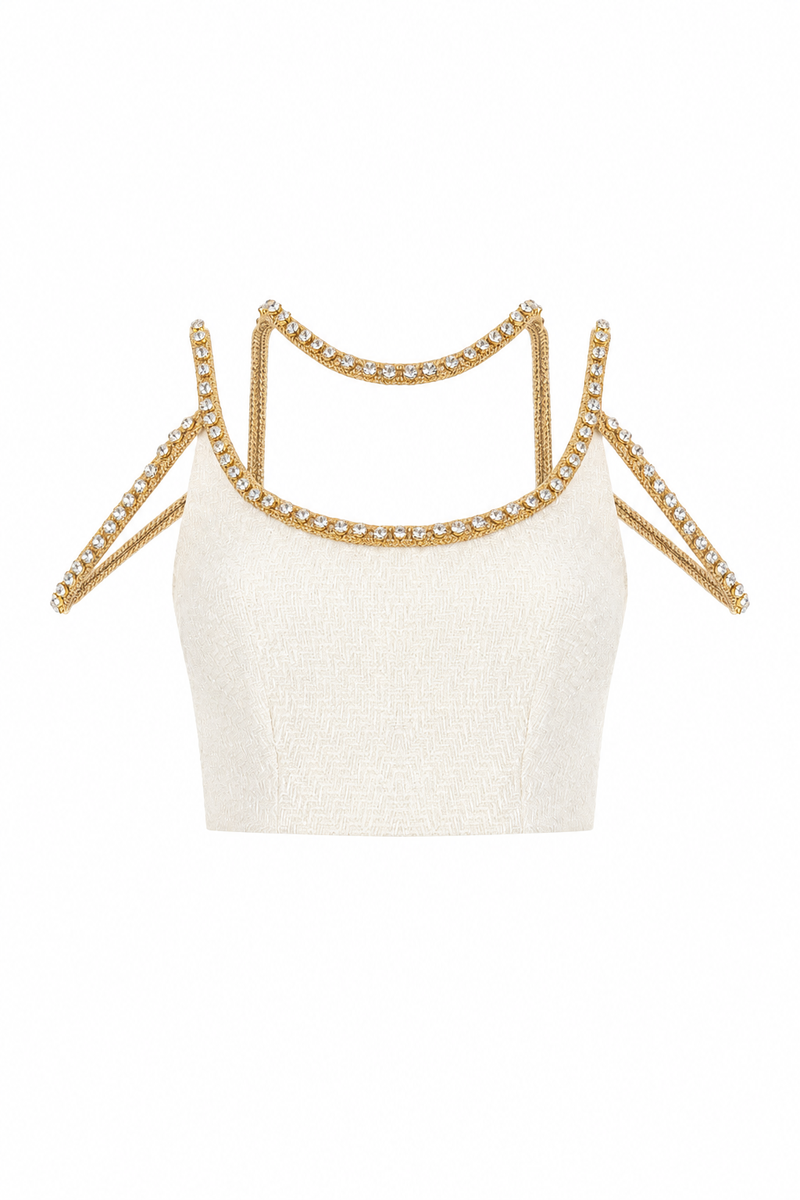 Gold thread-embroidered tweed top by Monika Dimova, featuring intricate gold embroidery on classic tweed fabric.