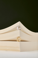 Golden Crono ring by Maria Frering featuring a sleek gold band and modern design, displayed on a neutral background.