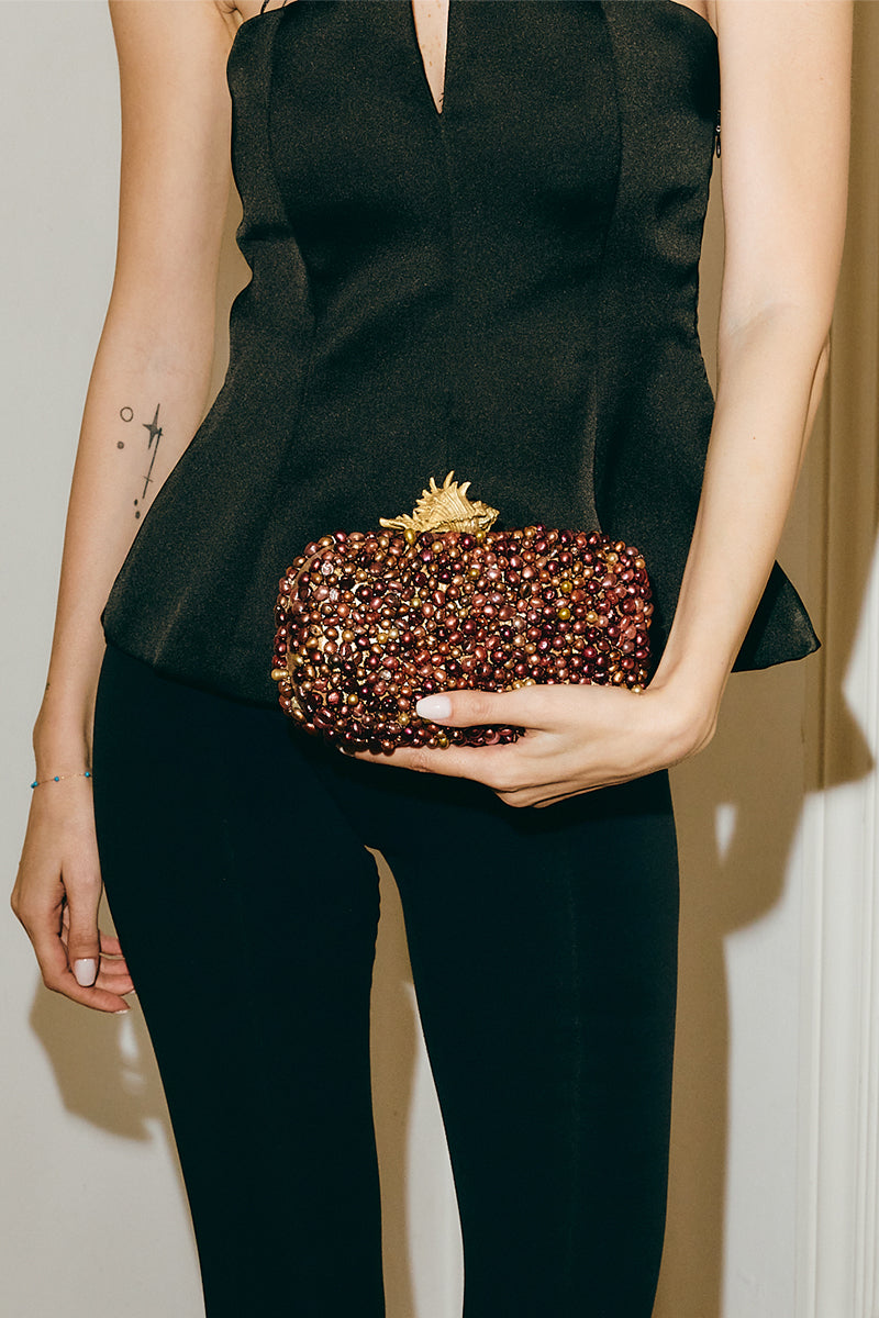 Golden Murex Loulou bronze clutch bag by Sarah's Bag, featuring intricate design and compact style in a bronze finish.