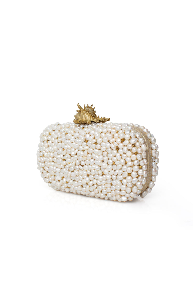 Sarah's Bag Golden Murex Loulou white clutch with intricate gold accents, stylish and elegant for evening occasions.