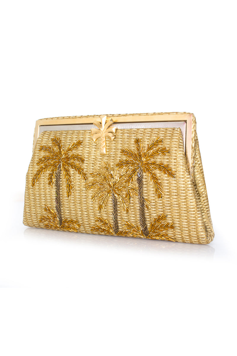 Side view of Sarah's Bag Golden Oasis Gold Straw Grace Clutch with intricate gold straw design and elegant hand strap.