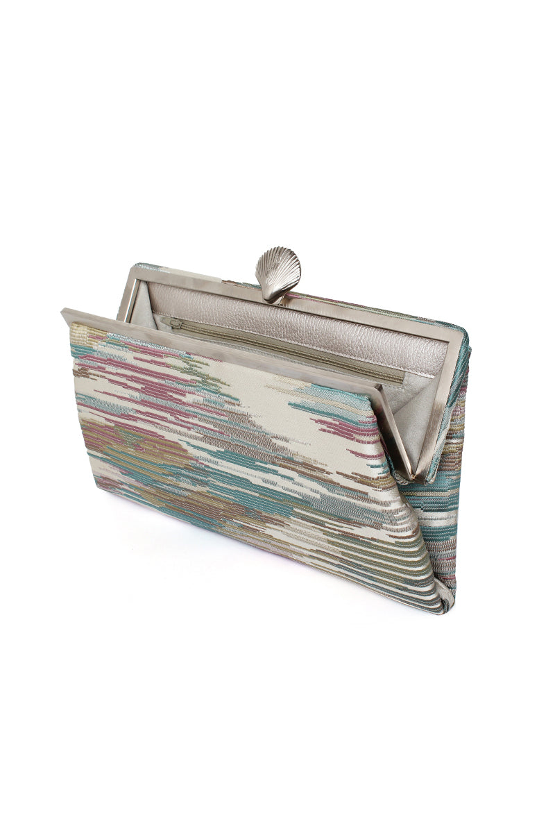 Sarah's Bag LUSH PASTEL GRACE clutch with pastel-colored fabric, open side showing interior, elegant and stylish accessory.