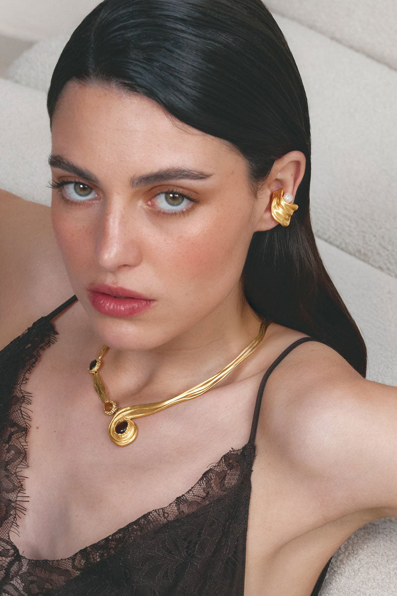 Gold gravity earcuff earrings by Jude Benhalim, featuring sleek, modern design in shiny gold finish.