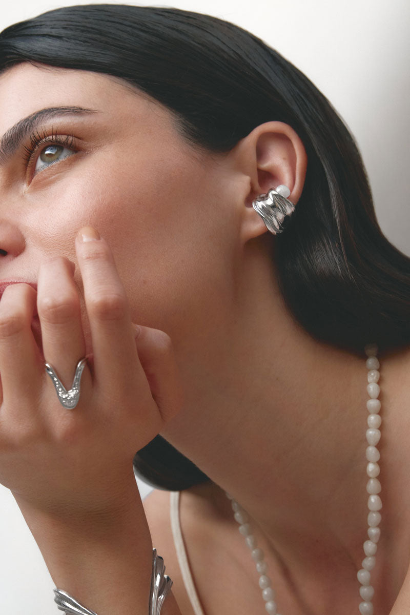 Silver Gravity Ear Cuff by Jude Benhalim featuring a sleek, minimalist design for modern ear jewelry.