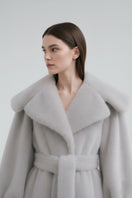 Gray faux fur coat by Fortini, stylish and plush, featuring a cozy design perfect for cold weather.