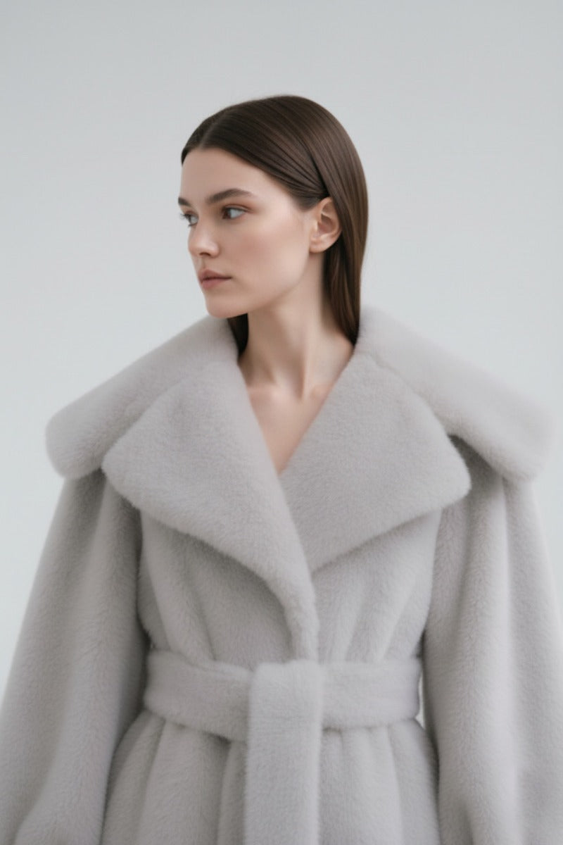 Gray faux fur coat by Fortini, stylish and plush, featuring a cozy design perfect for cold weather.