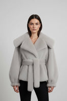 Gray faux fur jacket by Fortini, stylish Old Money design, showing soft texture and classic silhouette.