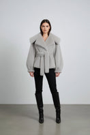 Gray faux fur jacket by Fortini, old money style, featuring a plush texture and classic cut, perfect for elegant winter wear.