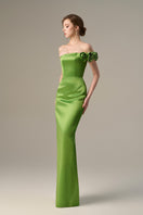 Green I.H.F gown with a bustier silhouette and satin floral appliqué, featuring elegant detailing and a flowing design.