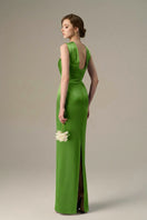 Green satin silk gown by I.H.F featuring a ruched neckline and tie, displayed on a mannequin.