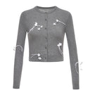 Gray 3D floral cardigan by Montsand, showcasing a cozy knit top with textured floral design in soft gray.