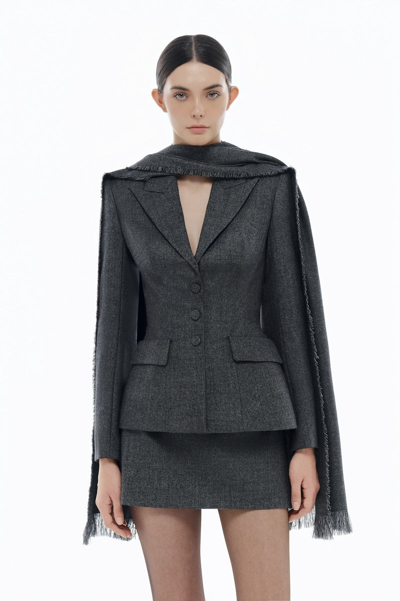 Gray single-breasted blazer by Montsand, shown with matching skirt, tailored fit, and classic lapel design.