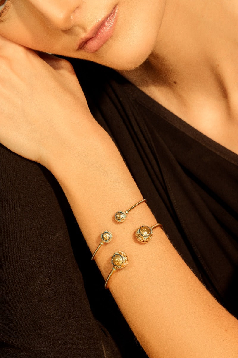 Álvaro Ávila Guardian Sphere Bangle Bracelet in blue, featuring a smooth spherical design on a sleek metal band.