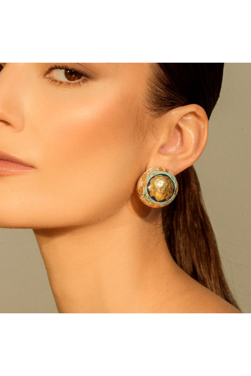 Álvaro Ávila Guardian Sphere Drop Earrings featuring blue spherical pendants hanging from silver hooks.