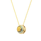 Álvaro Ávila Guardian Sphere necklace featuring a sleek, blue pendant on a delicate chain, displayed against a neutral background.