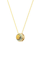 Álvaro Ávila Guardian Sphere necklace featuring a sleek, blue pendant on a delicate chain, displayed against a neutral background.