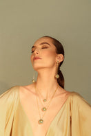 Álvaro Ávila Guardian Sphere Necklace featuring a sleek, blue pendant on a delicate chain, showcasing modern jewelry design.
