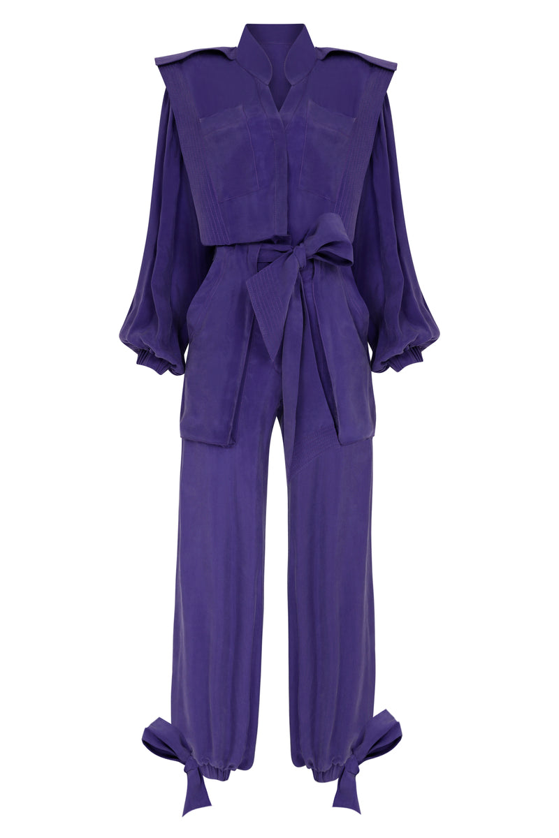 Purple Haleia jumpsuit with a belt, front view showcasing the stylish design and fitted waist for a chic, modern look.
