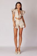 Beige handmade lace and ruffled linen jacket from Haleia, featuring intricate lace details and a stylish, feminine design.