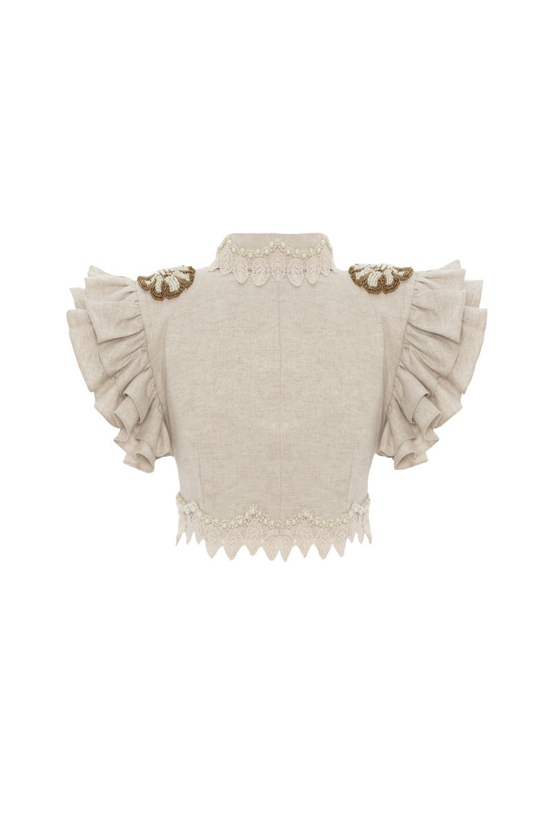 Beige handmade lace detailed ruffled linen jacket by HALEIA, shown from the back, with intricate lace and ruffle accents.