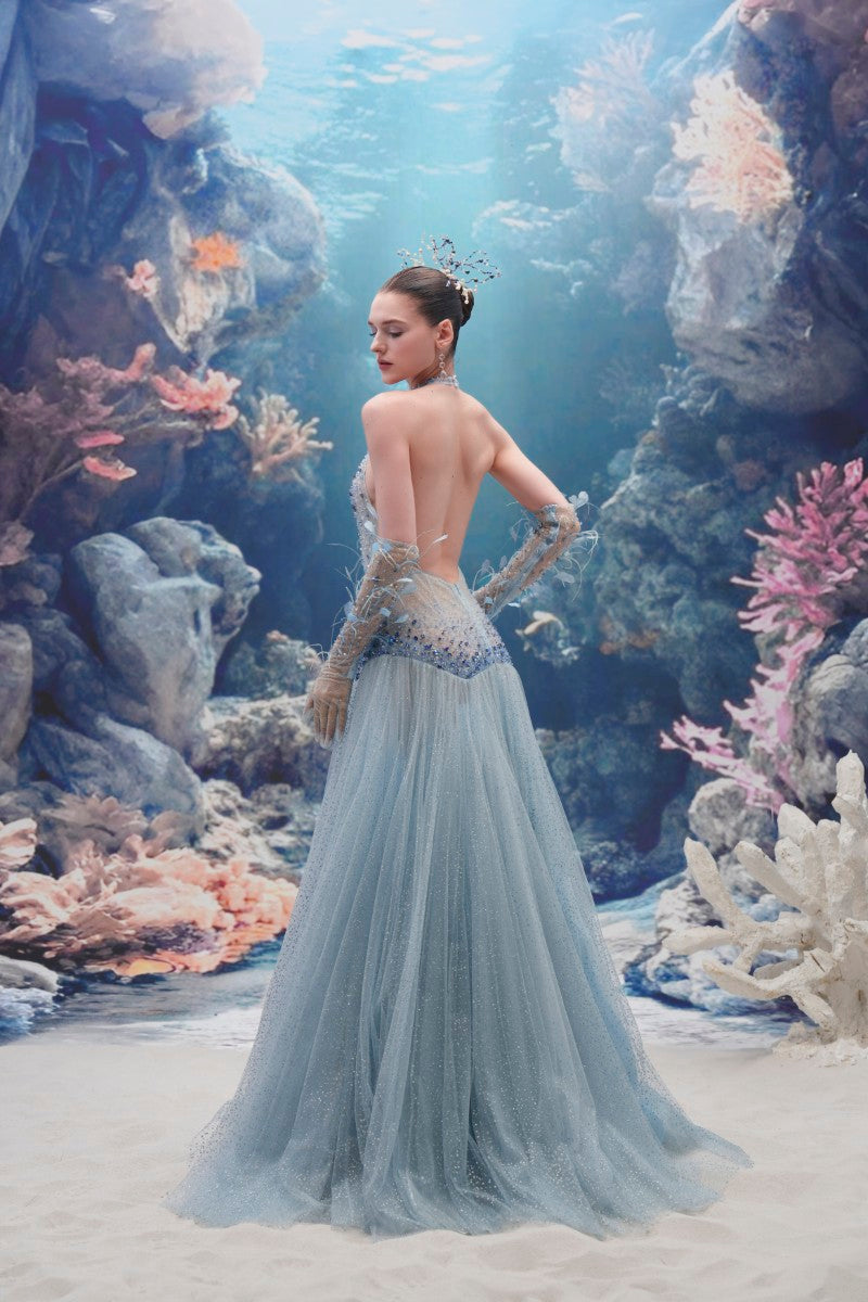 Light blue Muriel glitter tulle gown by 21Six with matching gloves, featuring a flowing tulle skirt and elegant design.